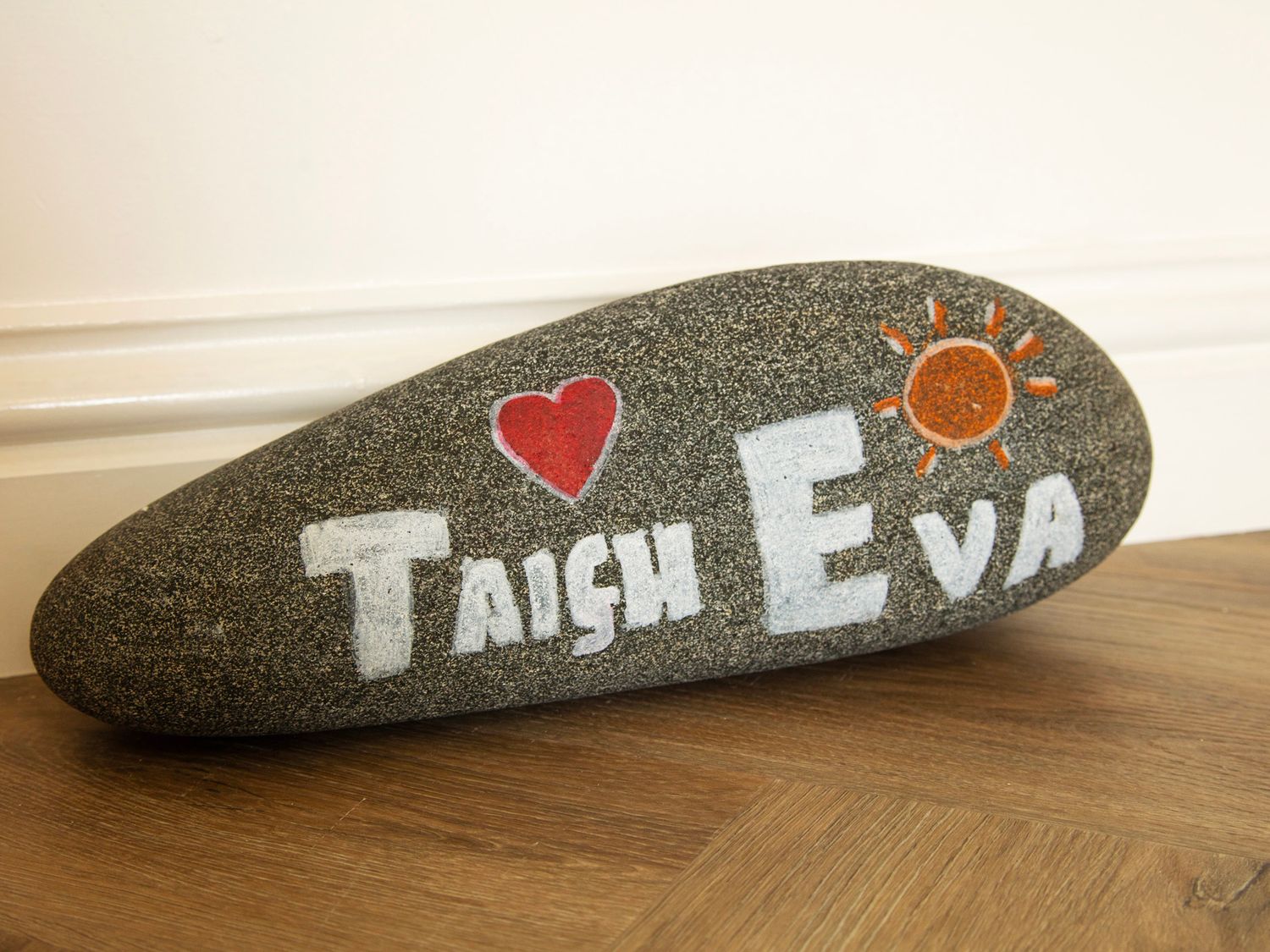 Painted Taigh Eva stone in the garden