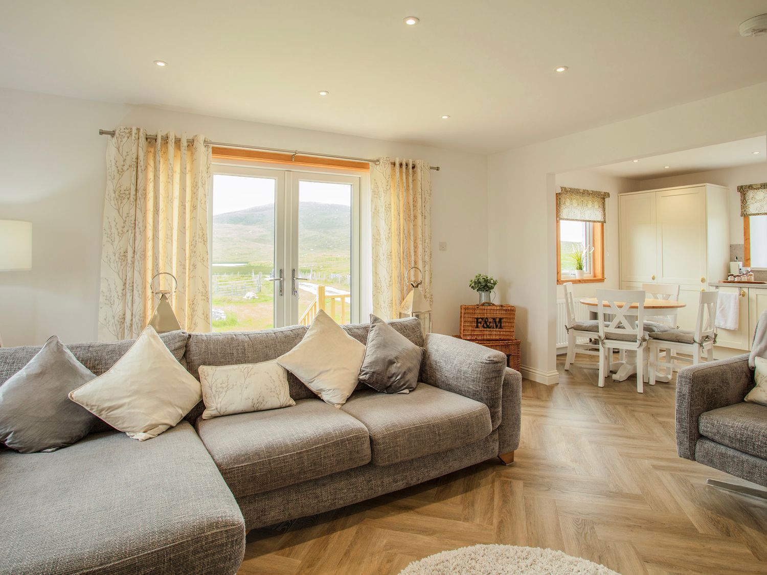Sitting room and dining area at Taigh Eva