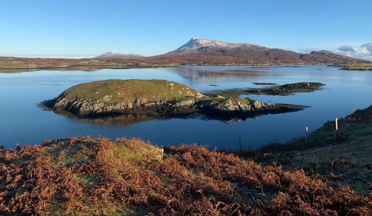 The Wheelhouse calm loch and snowy hill