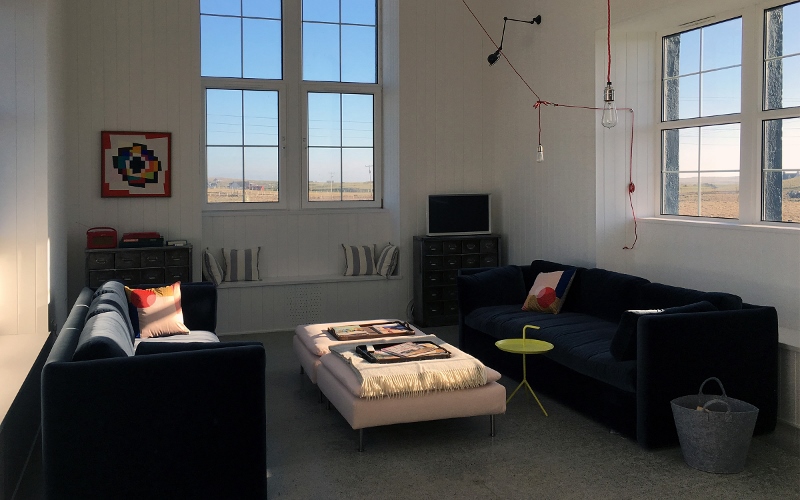Tigharry Schoolhouse lounge with sofas and table