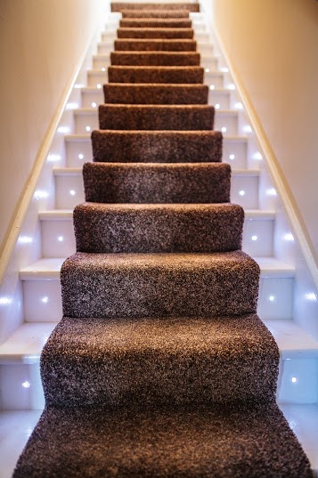 Hebrides House staircase with lights & carpet